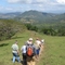 People hiking with mountain range in background
