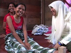 Damai, a young Indonesian girl injured in a 2004 earthquake, receives physical therapy during her recovery.