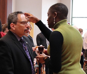 Tony De La Rosa, interim executive director of the Presbyterian Mission Agency, receives ashes from Simone Adams‐Andrade, coordinator for budget and mission effectiveness in Theology, Formation & Evangelism, during Ash Wednesday services at the Presbyterian Center in Louisville.