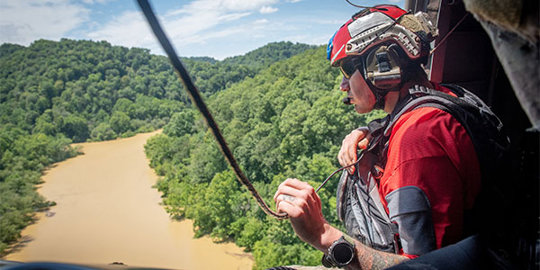 KY National Guard in helicoptor overlooking flooding in Eastern Kentucky