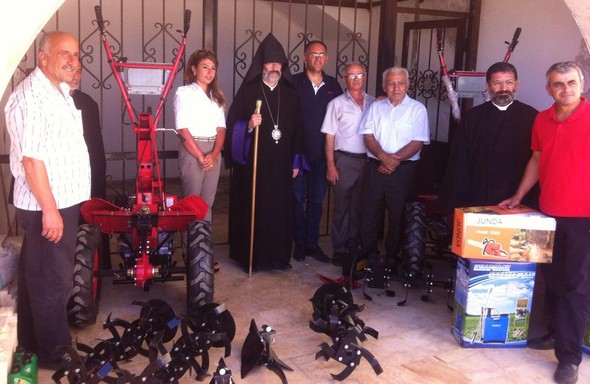 JMP director with local Kessab leaders and clergy with new farm equipment