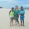 Imani, Marta, and Justin on the white sands of Kilifi, on the Indian Ocean