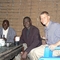 The Lobi parish near Bulape hosted a meal for us. Bob talks with Pastor Yeshaya (middle)