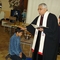 An Afghan teenager is baptized.