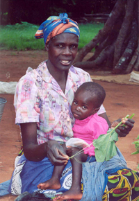 A mother holding her young child.