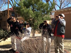 Menaul 6th grade boys on a bird watching expedition on Menaul School campus using binoculars purchased with John C. Martin Award grand funds.