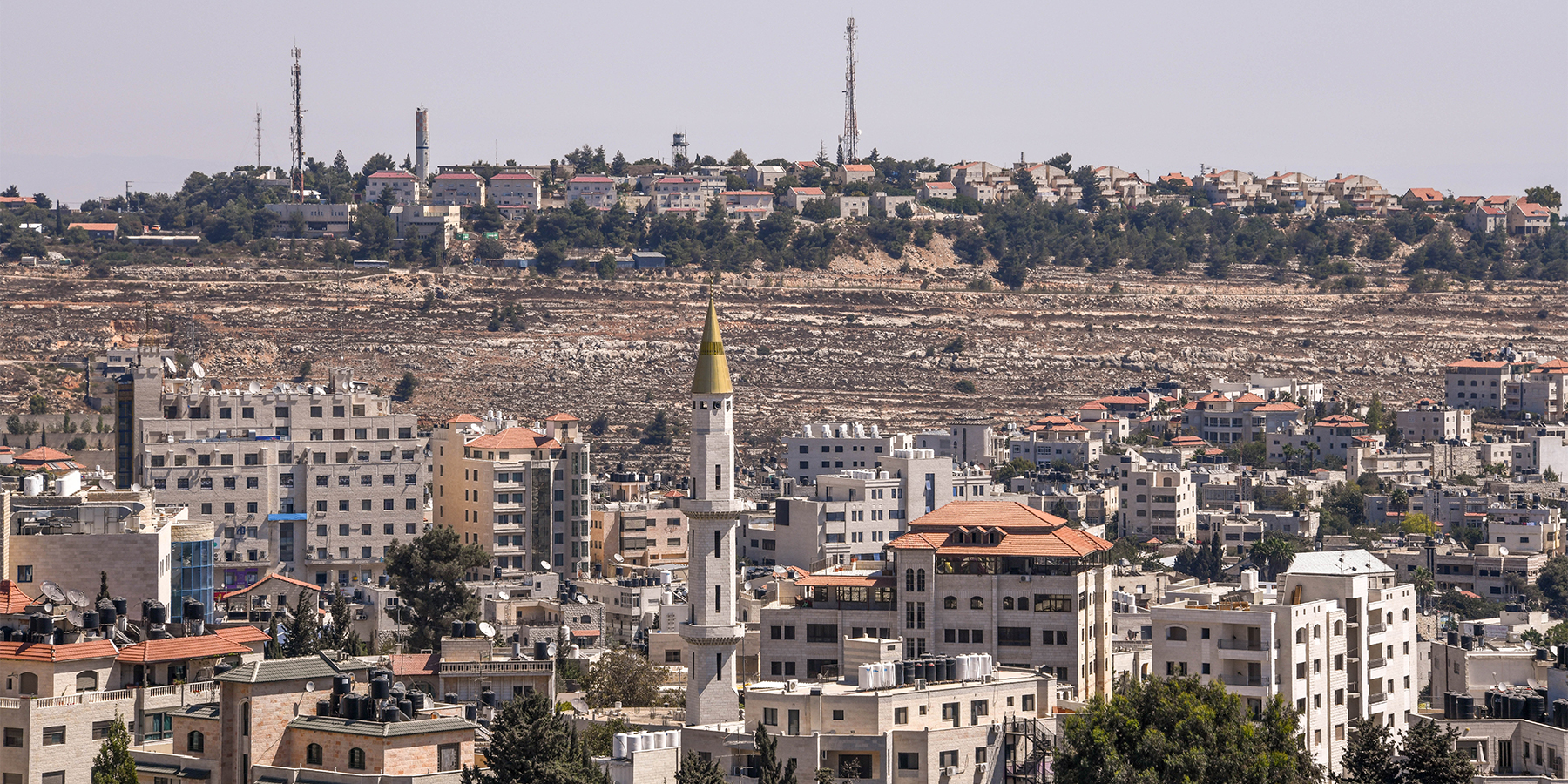 An Israeli settlement on a hill overlooking Ramallah in the West Bank of Palestine near Jerusalem. © Rex Wholster / Adobe Stock