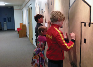 Children taking a hands-on approach to worship